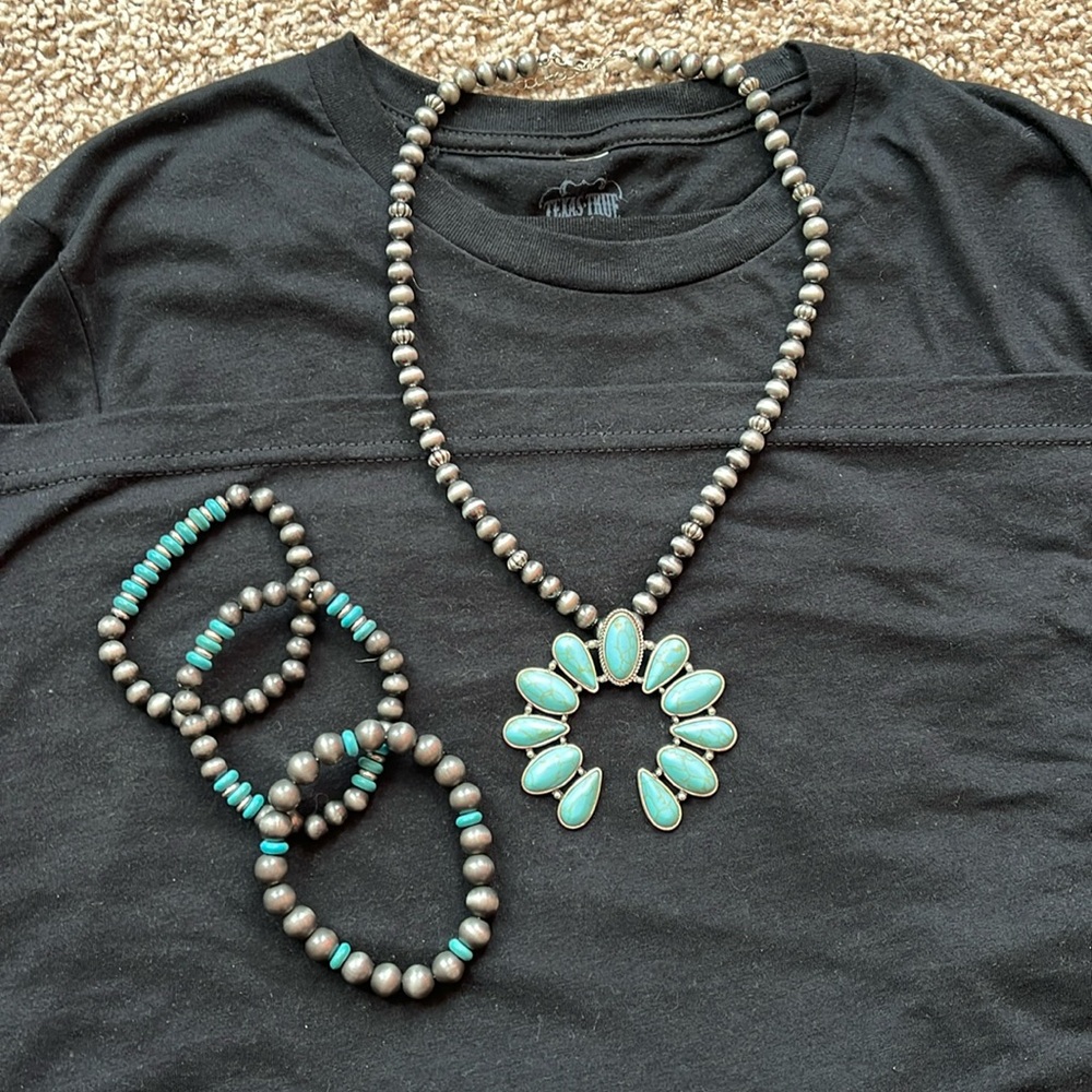 Western turquoise necklace with matching bracelets.